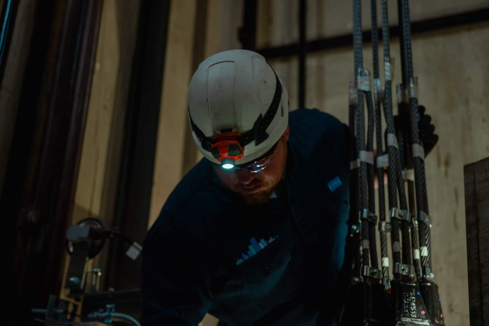 John Walsh Jr. works in an elevator hoistway